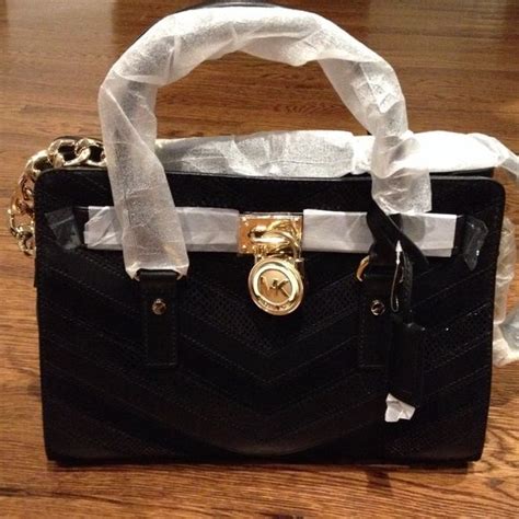 michael kors black purse with gold lock|michael kors gold crossbody bag.